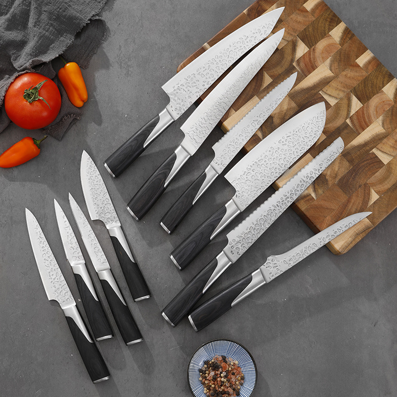 Kitchen knife collection arranged on a wood board